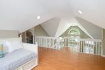 Upper level lofted area overlooks the living room